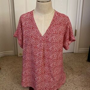 Red and white leaf like patterned women’s size large blouse